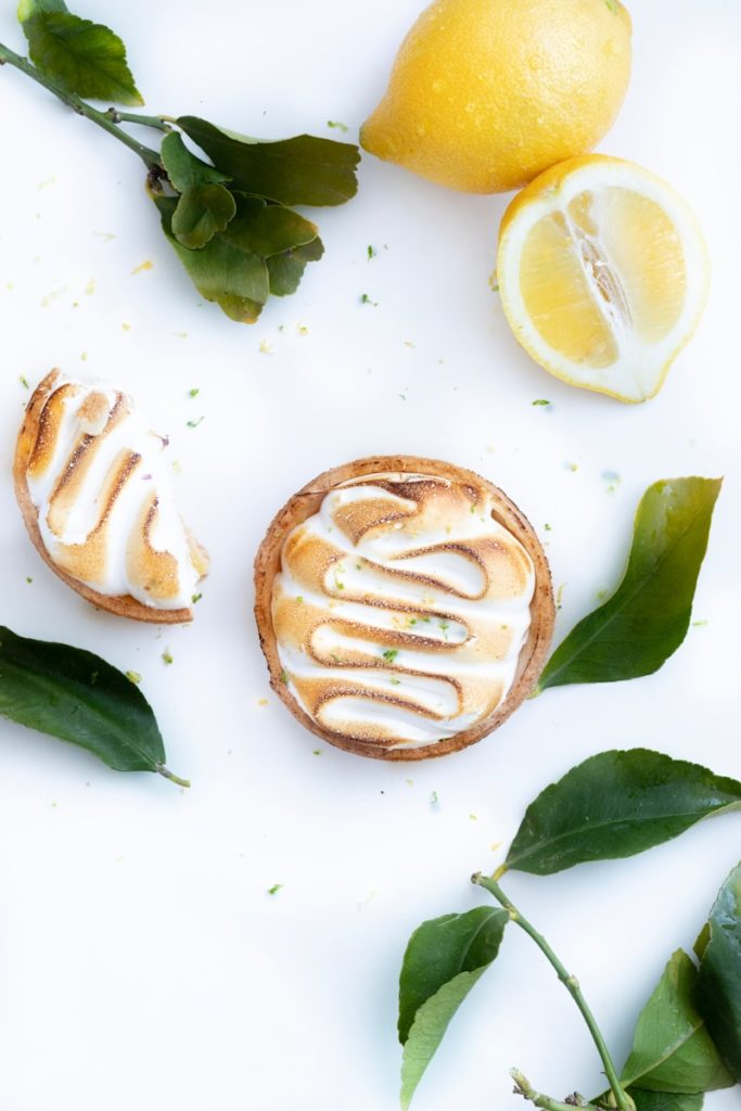 bread with sliced lemon on white table